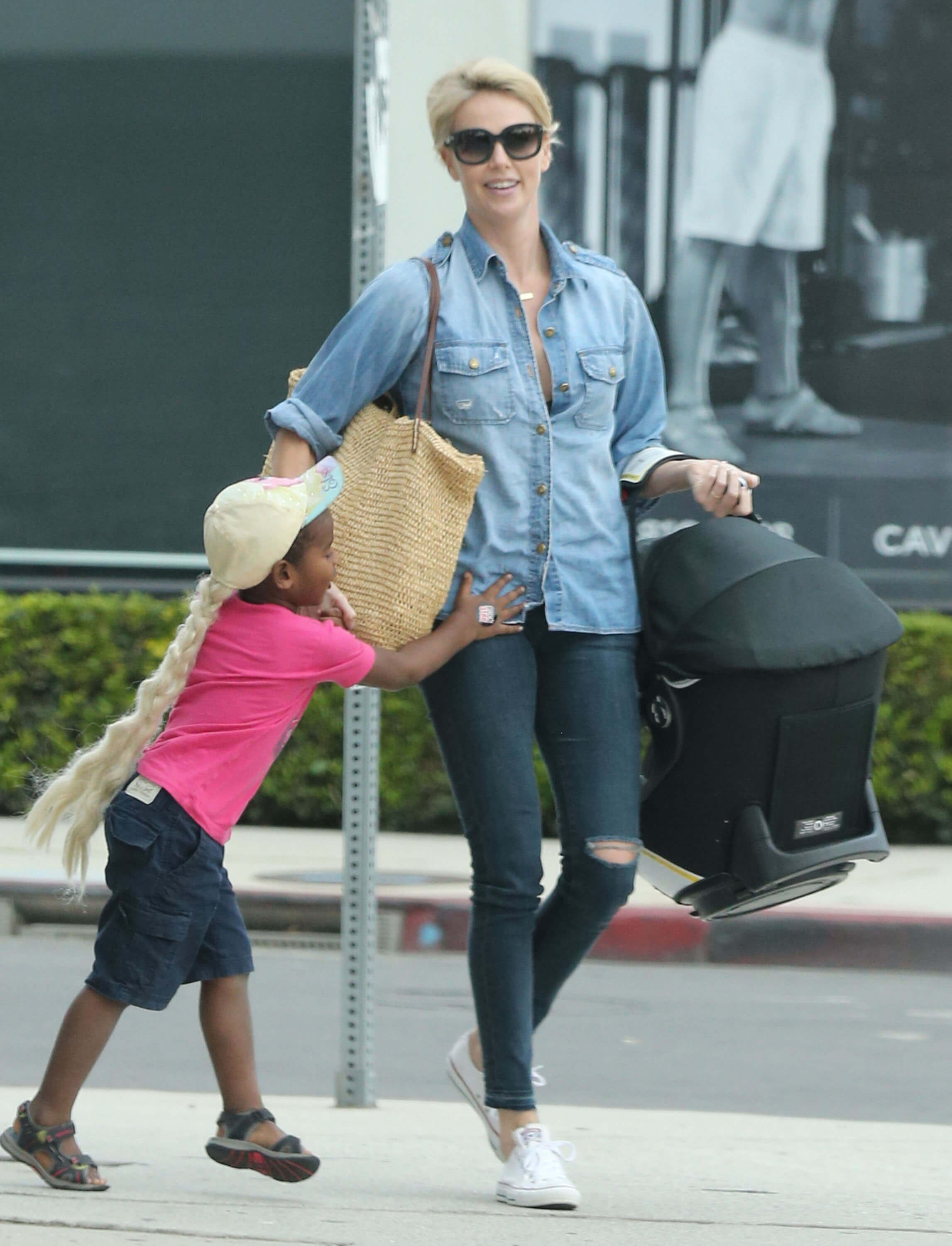 Exclusive... 51881071 Actress Charlize Theron spotted out with her new baby daughter, August in Hollywood, California on October 16, 2015. Her son Jackson is wearing a pink t-shirt and Elsa wig. NO INTERNET USE WITHOUT PRIOR AGREEMENT FameFlynet, Inc - Beverly Hills, CA, USA - +1 (818) 307-4813