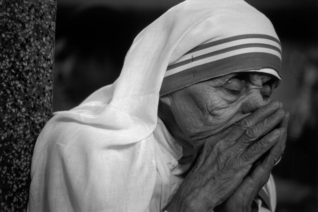 INDIA. Mother Teresa. 1989. Mother Teresa at her refuge of the Missionaries of Charity in Calcutta. During prayer. Mother Teresa is the leader of the Missionaries of Charity (Nirmal Hridaya/Pure Heart) Order which is located in Calcutta.They were founded by in 1957 when she ran a home for the dying and destitute Nirmal Hriday in the Kalighat suburb of Calcutta.In 1979 she was awarded the Nobel PEACE PRIZE, and has continued to travel the world in charitable efforts to expand her Missionary of Charity to other countries outside of India. She was born on the 27th August 1910 in Skopje (Yugoslavia) her maiden name is Agnes Gonxha Bajaxhiu.