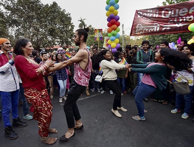 New Delhi: LGBT Community members and supporters dance during the Delhi Queer Pride March in New Delhi on Sunday. PTI Photo by Kamal Singh (PTI11_27_2016_000180B)