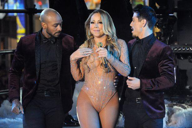 Mariah Carey in abito da sera e occhiali scuri al rivenditore di marjiuana la Vigilia di Natale - Mariah Carey performs during a concert in Times Square on New Years Eve in New York - Gay.it
