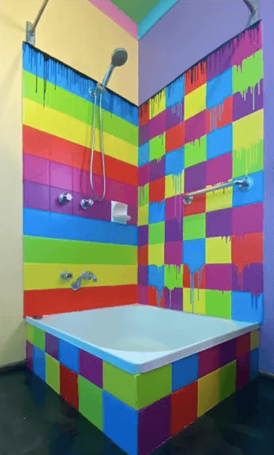 Vittima di omofobia, i vicini lo aiutano a dipingere la casa con i colori dell'arcobaleno - bagno - Gay.it