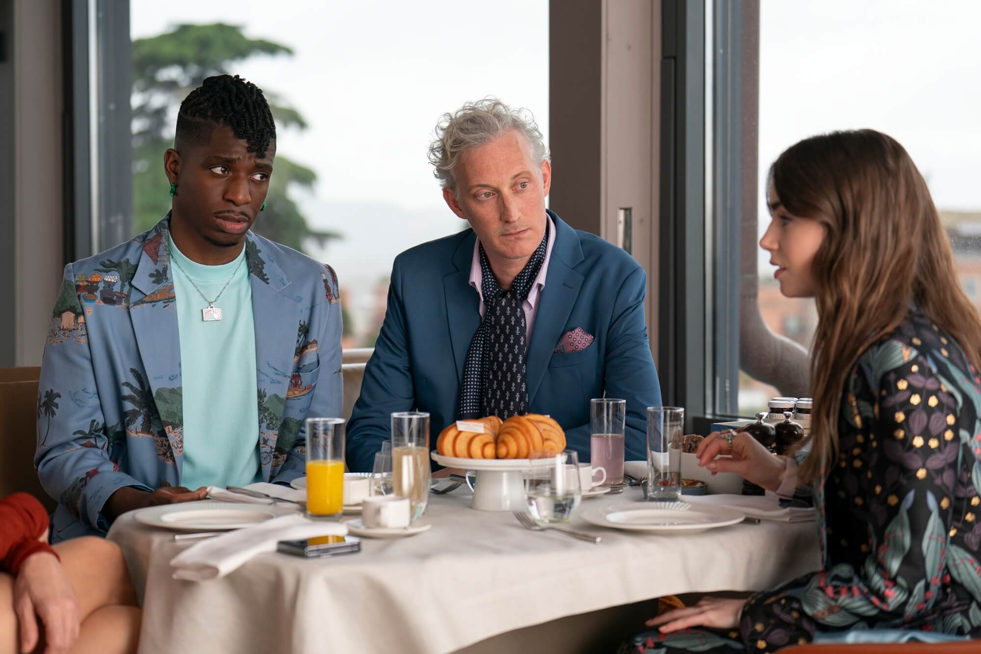 Emily in Paris. Samuel Arnold as Julien, Bruno Gouery as Luc, Lily Collins