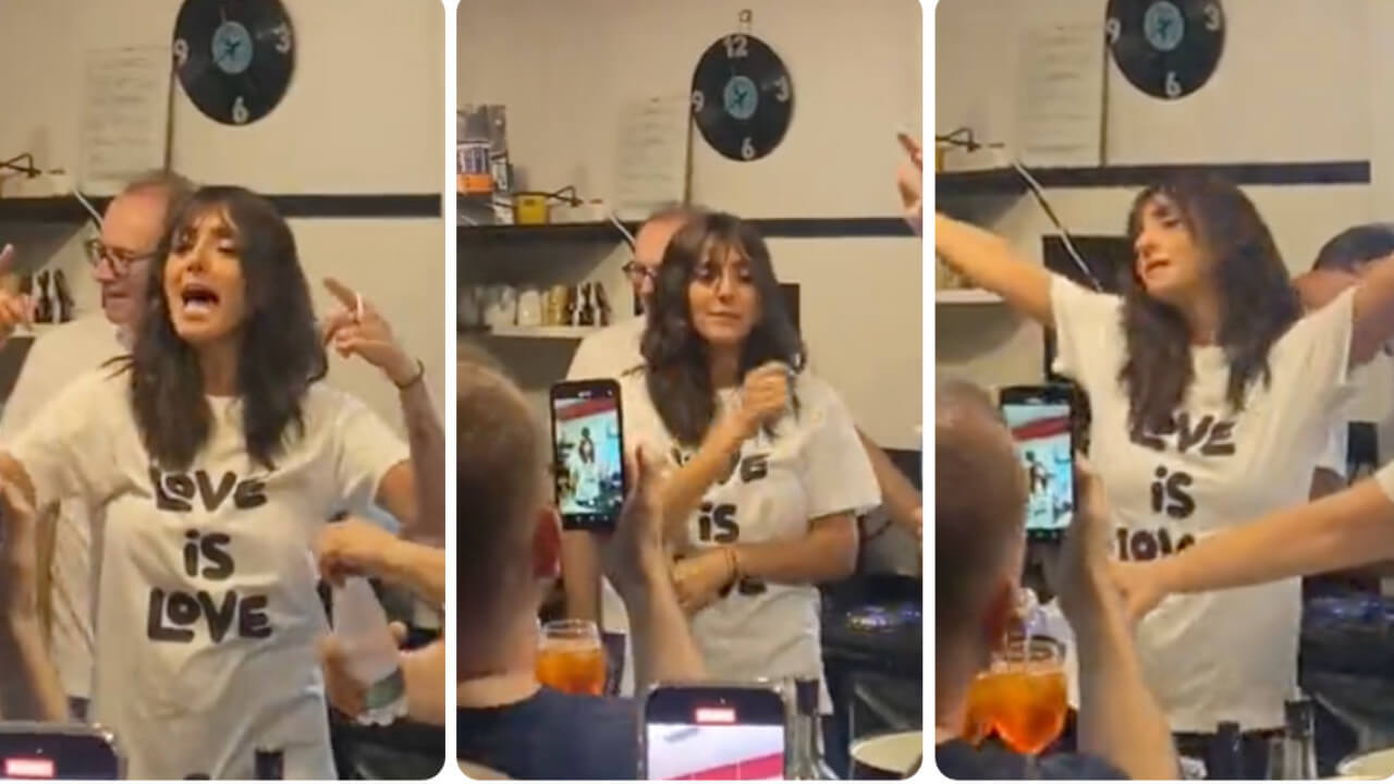 Ambra canta e balla “T’appartengo” al bancone di un bar, lo show a sorpresa manda in delirio i fan – VIDEO