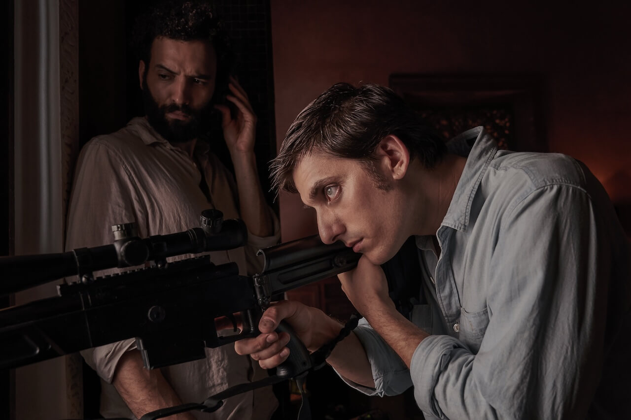 THE OLD GUARD (L to R) MARWAN KENZARI as JOE and LUCA MARINELLI as NICKY in THE OLD GUARD. Cr. AIMEE SPINKS/NETFLIX © 2020